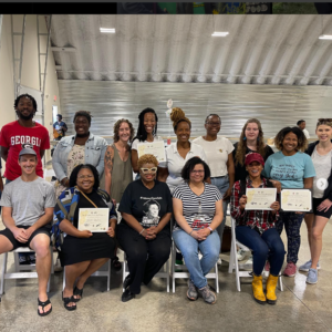 Beekeeping students pictured with instructor Mika Hardison and Clara White Mission CEO, Ju'Coby Pittman. 12 graduates for the class of 2023