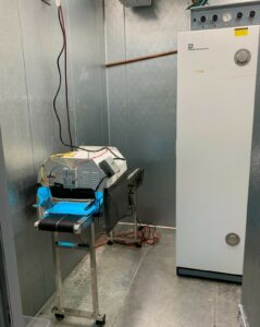 Walk in growth chamber set up for experiments with housing, conveyor and incubator